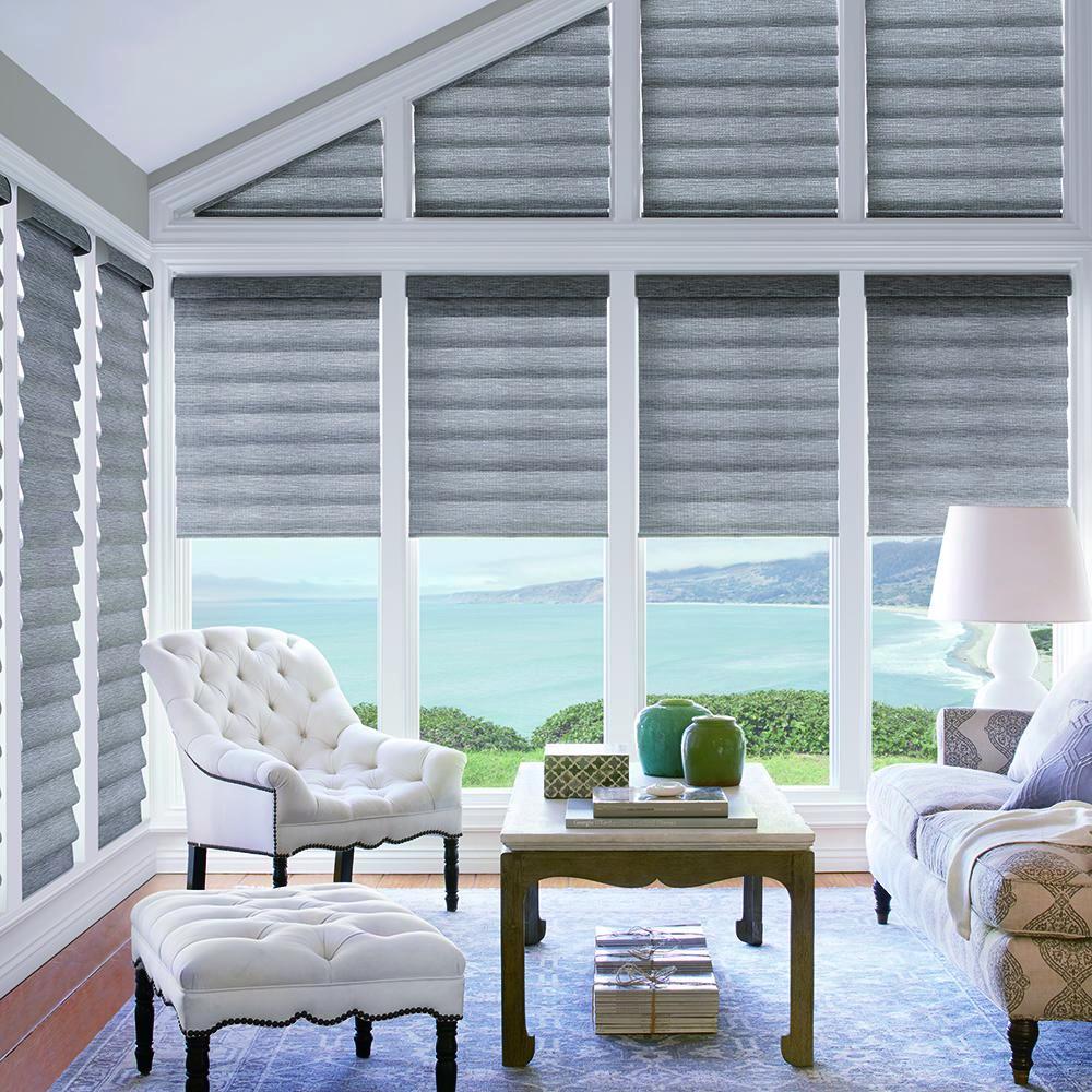 Custom sized grey Vignette window treatments in a sun room. Available at JC Licht in Chicago, IL