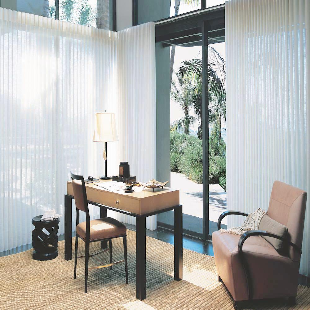 Luminette Window coverings in a glass office, available at JC Licht in Chicagoland.
