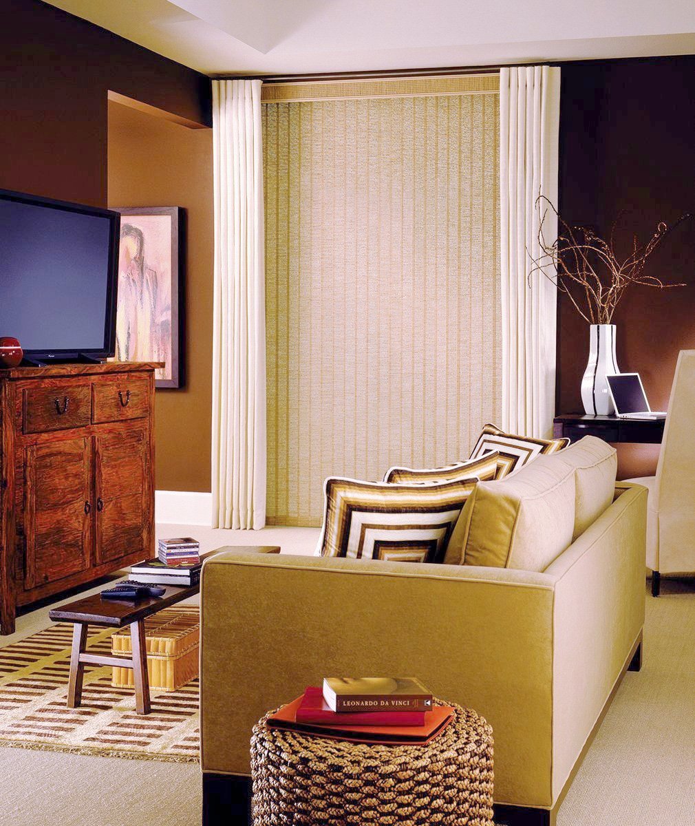 Hunter Douglas Window Treatments vertical solutions used in a living room. Available at JC Licht in Chicago, IL