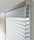 Close-up view of a Hunter Douglas Silhouette window treatment. Available at JC Licht in Chicago, IL
