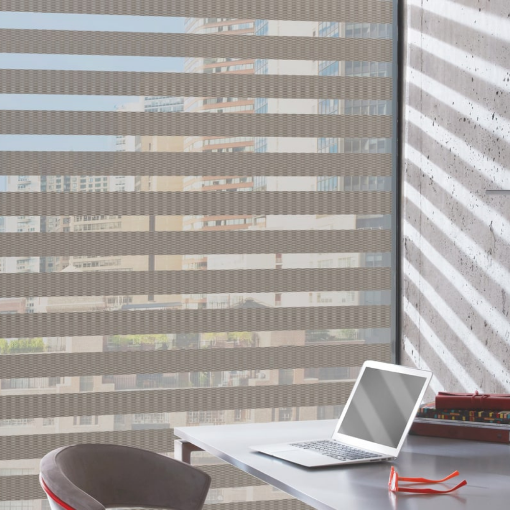 Hunter Douglas Designer Banded window shades in an office. Available at JC Licht in Chicago, IL