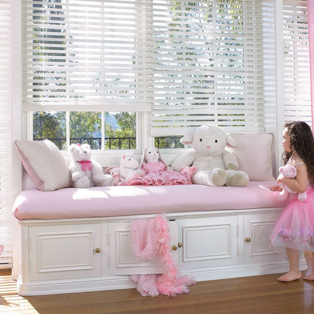 EverWood Distinctions window blinds used in a child&#39;s pink bedroom. Available at JC Licht in Chicago, IL