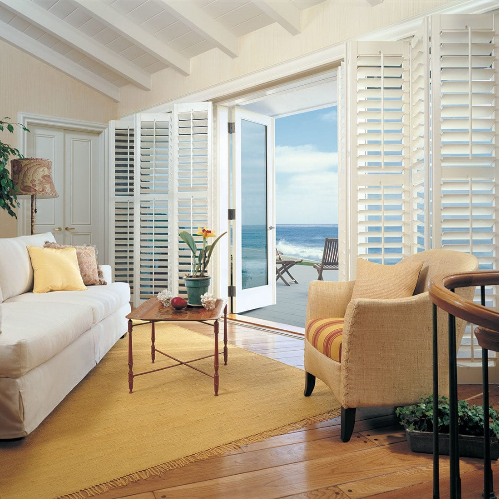 Heritance Shutters used in a sunroom. Available at JC Licht in Chicago, IL