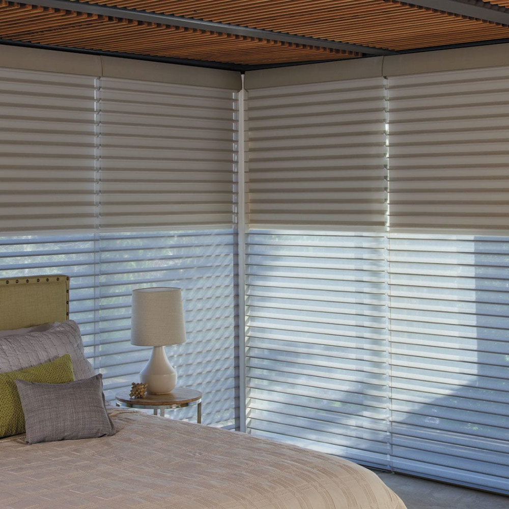 Nantucket window treatments adding privacy in a bedroom. Available at JC Licht in Chicago, IL