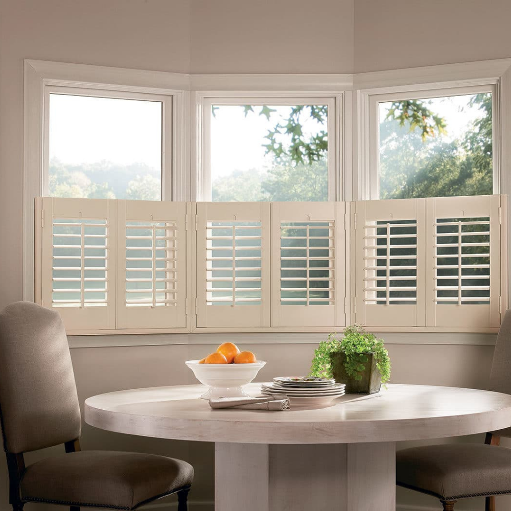 NewStyle Hunter Douglas shutters in a dining room. Available at JC Licht in Chicago, IL