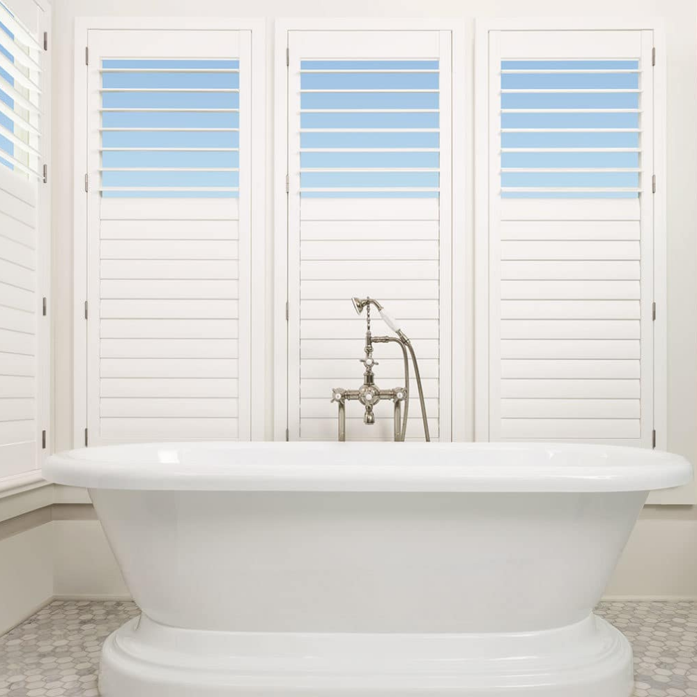 Palm Beach window shutters in a bathroom. Available at JC Licht in Chicagoland