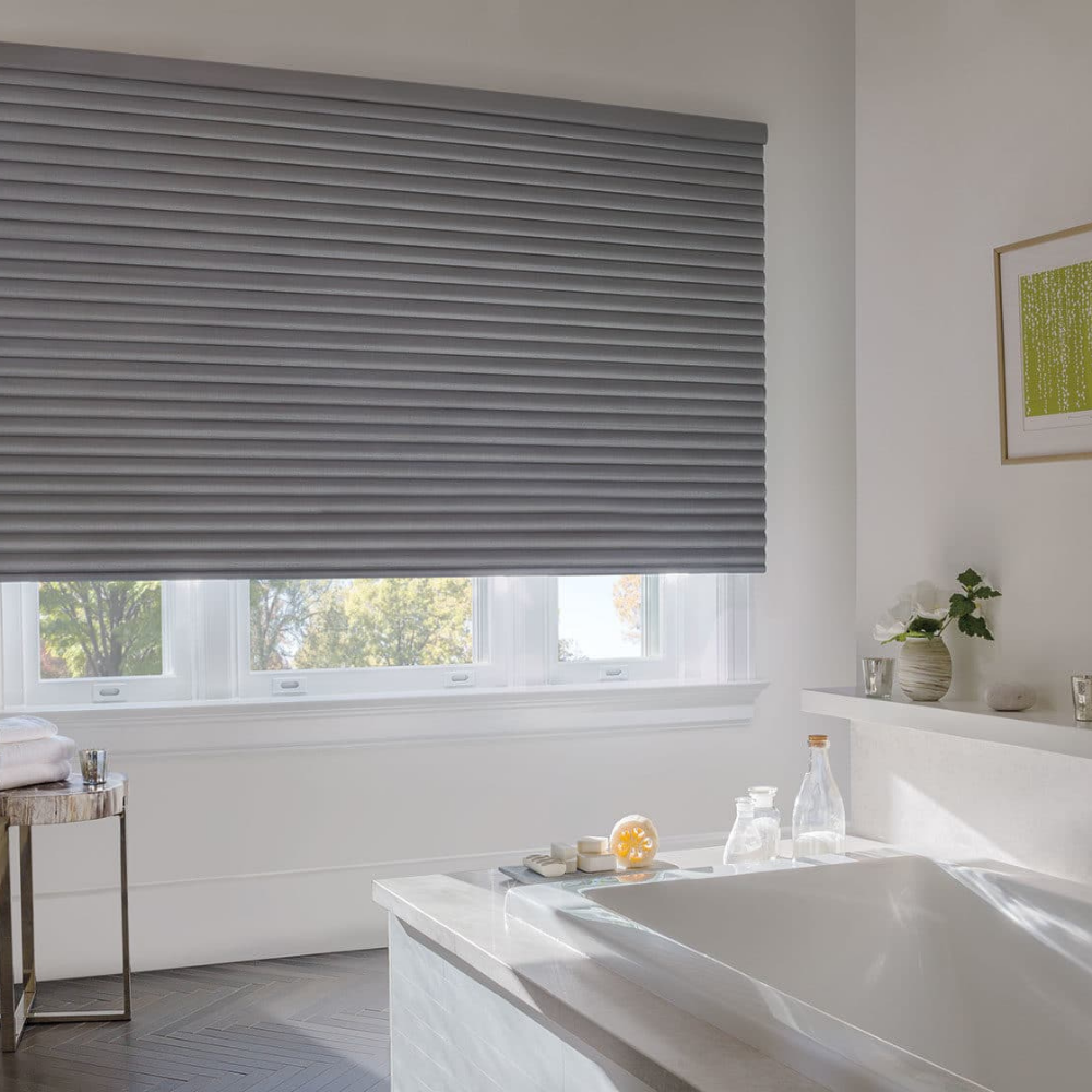 Gray Sonnette window treatments in a bathroom. Available at JC Licht in Chicago, IL
