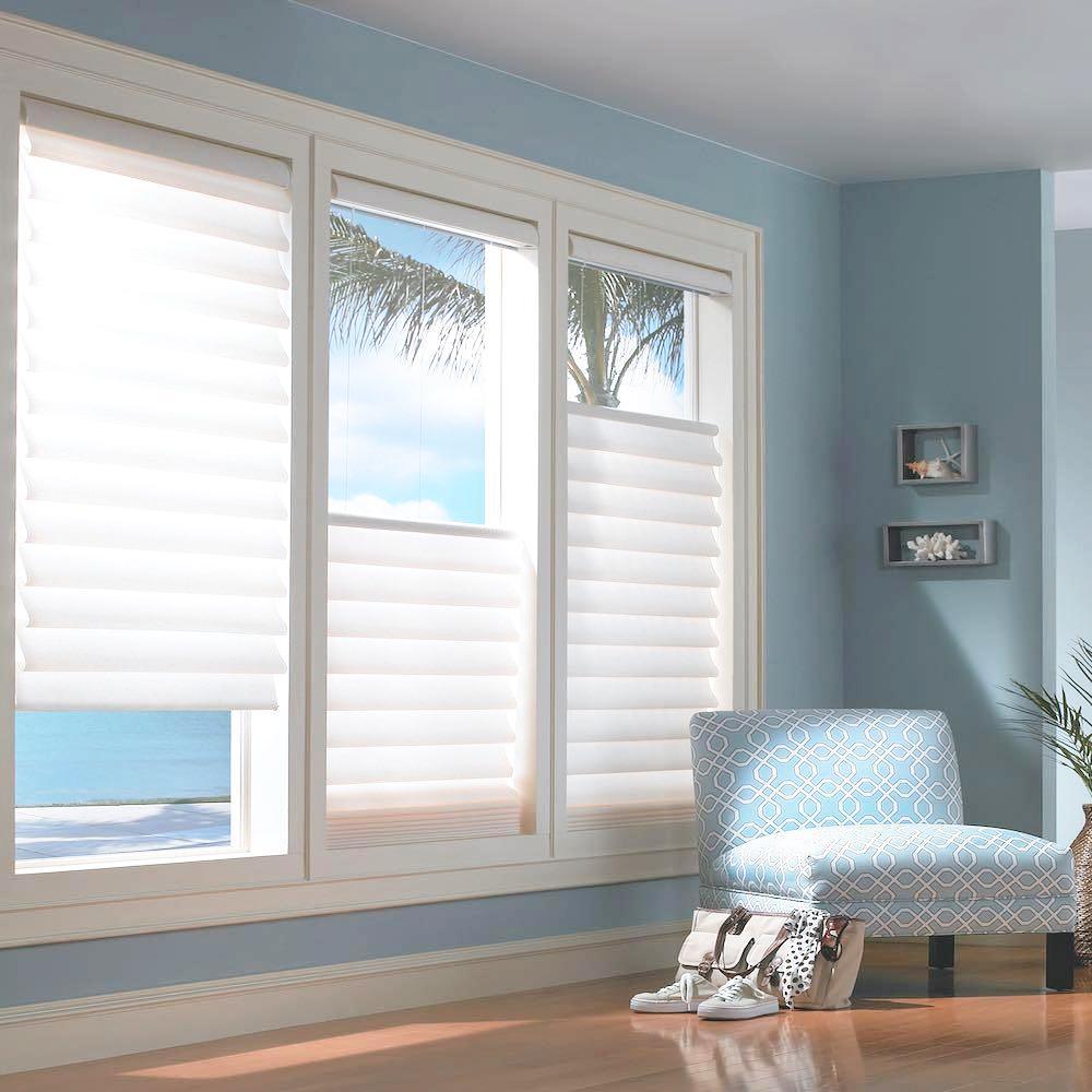 Vignette Window treatments in a blue sun room. Available at JC Licht in Chicago, IL